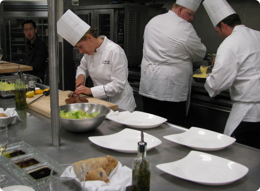 Chefs busy preparing foods in the kitchen